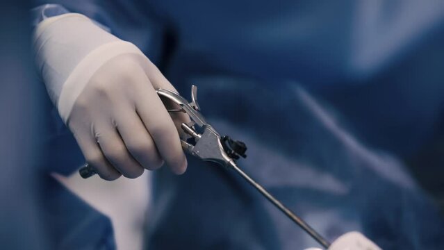 Professional surgeons in the operating room. Instrument for laparoscopic surgery. A surgeon performs laparoscopic gastric surgery in the operating room.