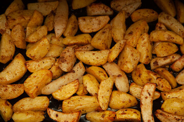 baked potatoes. Golden texture. Potatoes in the oven.