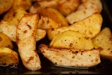 baked potatoes. Golden texture. Potatoes in the oven.