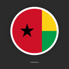 Guinea-Bissau circle flag icon with white border isolated on dark grey background.