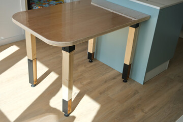 DIY wooden table with plywood top, wood and steel legs.