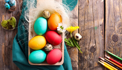 Colored easter painted eggs. Easter eggs in a basket