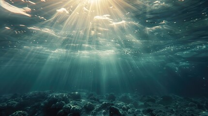 Serene underwater scene with sunlight peering through the ocean surface