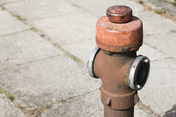 Red paint fire hydrant. Isolated on pavement. Fire department water supply for emergency. Old rusty...