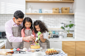 Portrait of enjoy happy love asian family father with little asian girl daughter child play and having fun cooking food together with baking cookie and cake ingredient in kitchen