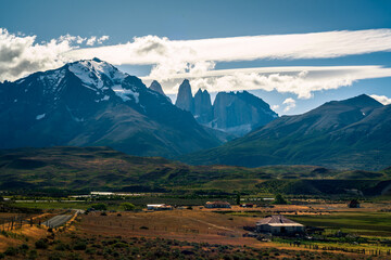 Las Torres Base behind the mountain and city as foreground and dramatic cloud (Patagonia, Chile, torres del paine)