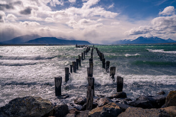 Puerto Natales view point with mountain as background and sea as foreground (Torres del Paine,...