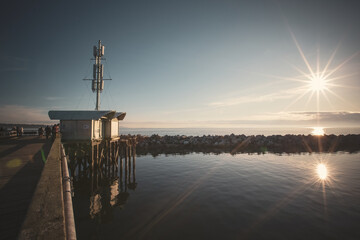Old wooden pier with a house in White Rock, South Surrey, Canada
