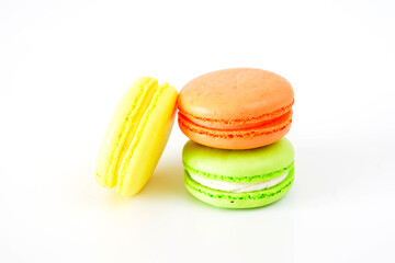 three different colored macarons are stacked next to each other close up
