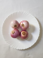 Fresh onions  on a plate