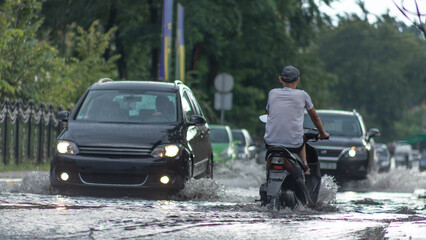 Braving the Elements: Moped Travels Through Rain and Flood