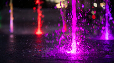 Nighttime Oasis: Fountain Sparkles Underneath the Evening Lights