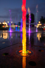Twilight Splendor: Fountain Shimmers Underneath the Evening Glow - 773934734
