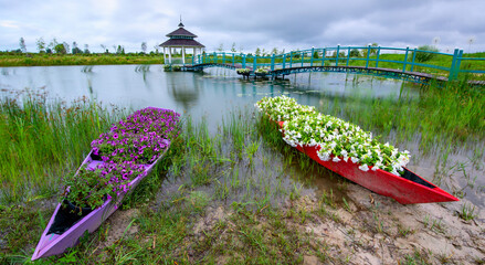 Bridge Over Blooms: Gazebo Adorned with River Flowers