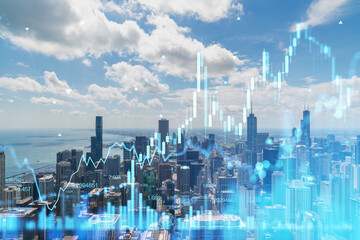 Chicago skyline with a hologram concept of stock market data over the urban cityscape, against a cloudy sky. Double exposure