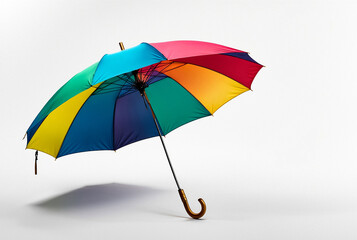 Colorful rainbow umbrella on white background, studio shot. Vibrant multi-colored umbrella open and isolated on a white backdrop. Advertising object concept. Copy ad text space