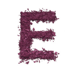 Stencil capital letter E made by burgundy crushed eye shadow or broken powder isolated on white background.