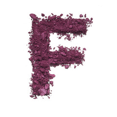 Stencil capital letter F made by burgundy crushed eye shadow or broken powder isolated on white background.
