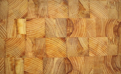 Fototapeta premium Oak wooden butcher chopping block, natural durable end grain hard wood board texture background pattern close up