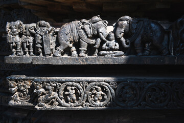 Beautiful carvings of elephants at the ancient Hoysaleshwara temple in Halebidu in Karnataka.