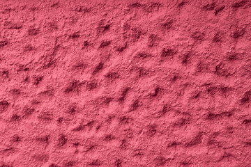Abstract geometric concrete background with 3D structure with dots and fosse of the concrete in raspberry color with copy space