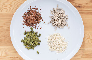Seed cycling for hormone balance, to balance pre and post menopausal hormones. Flax, pumpkin, sesame and sunflower seeds. Balancing hormones - estrogen and progesterone. Woman health, fertility