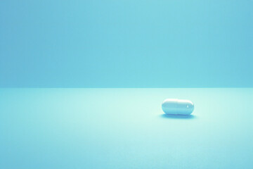 Pill on blue background, medicine concept