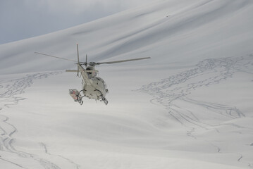 Freeride snowboarding in winter. Heliboarding freeride. Riding in powder on snowborad. Freeride in...