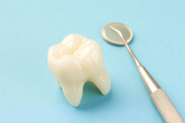 dental care concept, white teeth on blue background