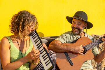 Joyful street music duo performing in a sunny town