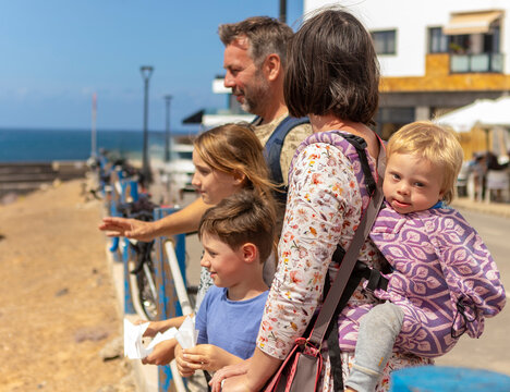 Family enjoying time together at a seaside promenade