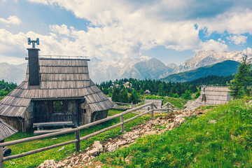 Traditional Mountain Wooden Shepherd Shelters on Big Pasture Plateau or Velika Planina in Slovenia - 773973949
