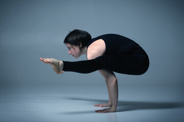 Tittibhasana, Ashtanga yoga  Side view of woman wearing sportswear doing Yoga exercise