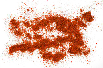 Scattered piles of red paprika spices isolated on a transparent background. Top view.
