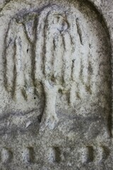 tree of life carved into a stone wall.
