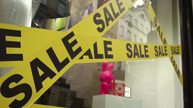 Sale: sales promotion marked with stickers on shop window
