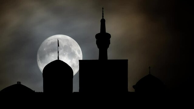 Shrine of Imam Ali bin Musa Al-Rida,  Time Lapse by Night with Full Moon, Mashhad, Iran