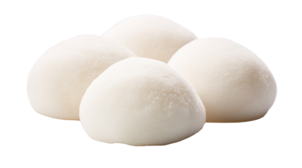 Four white cotton balls scattered on a pristine white background