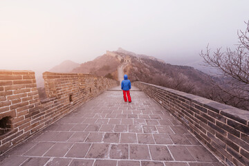 Young woman on the Great Wall of China.