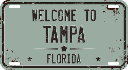 Welcome To Tampa Message on Rusty License Plate