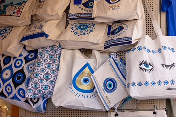 Typical souvenir shop on a street in district Plaka, fabric bags with patterns, eye of prophet, Athens, Greece