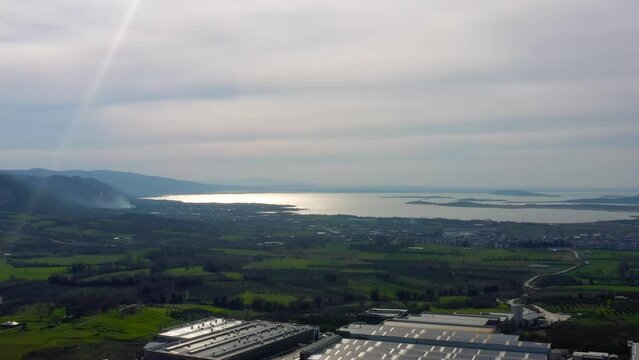 Aerial view of Uluabat Lake and G&ouml;lyazı Village from Ak&ccedil;alar district on a cloudy sunset.