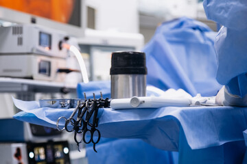A medical team performs a surgical operation in a modern operating room. Concept of surgical...