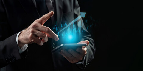 A businessman points at a graph displayed on a tablet, analyzing data, business strategy, technology in business concept