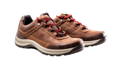 A pair of brown shoes with vibrant red laces elegantly intertwined, creating a striking contrast