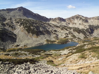Mountain lake surrounded by rocky cliffs.