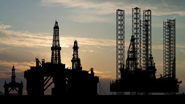 Oil platform for gas and petroleum on the ocean, Time Lapse at Sunrise with Colorful Clouds