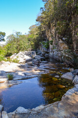 Fototapeta na wymiar Small waterfall with a big pool . It is located in São José da serra next to Serra do Cipó region in Minas Gerais, Brazil