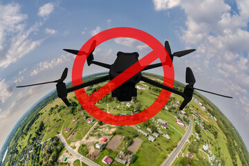 No drone zone sign concept for banning the use of drones in airspace. drone silhouette in red circle with crossed out stripe on tiny planet background