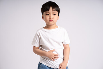 Portrait of an Asian boy posing on the white background